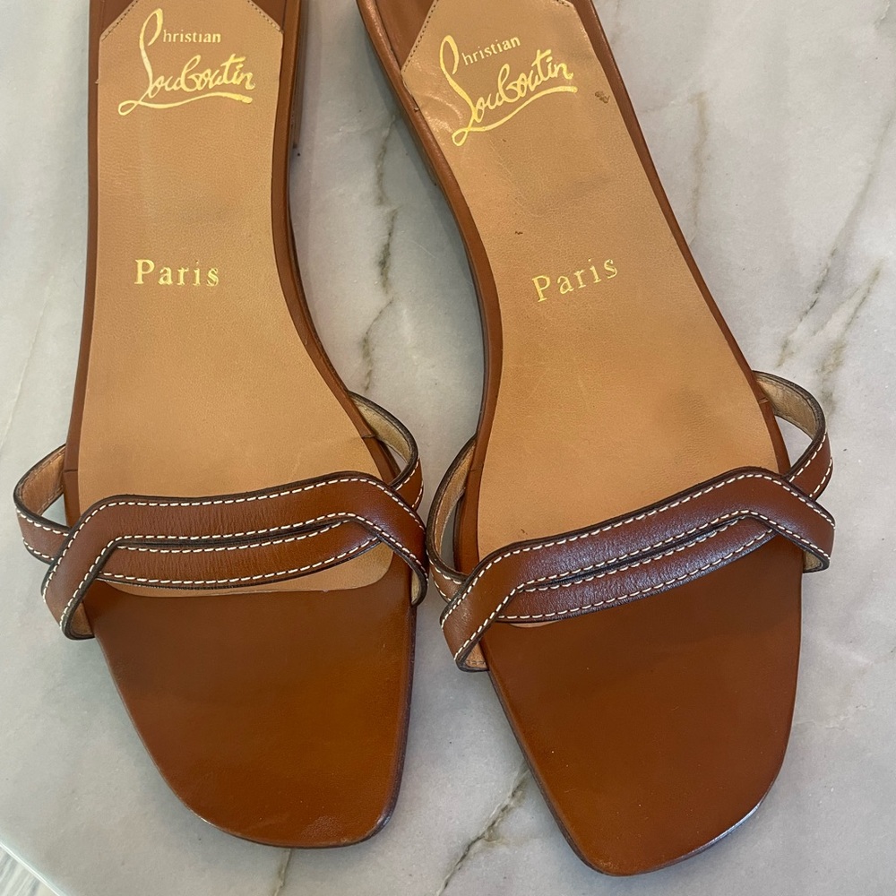 Brown Christian Louboutin slides